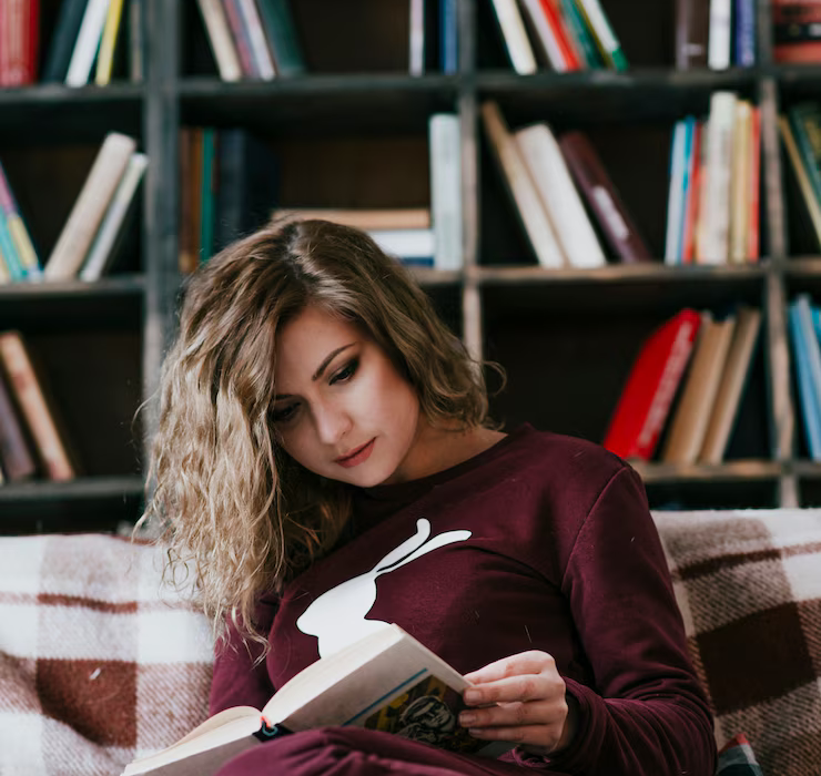 young-woman-enjoying-reading.png